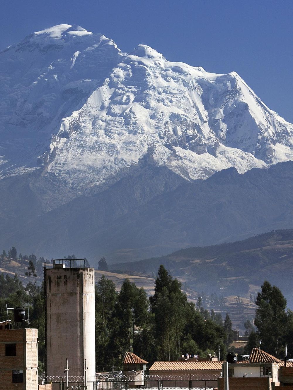 Snow-capped mountain with a clear blue sky, iconic landmark of Peru, outdoor adventure, travel destination, Andes mountains, Machu Picchu.
