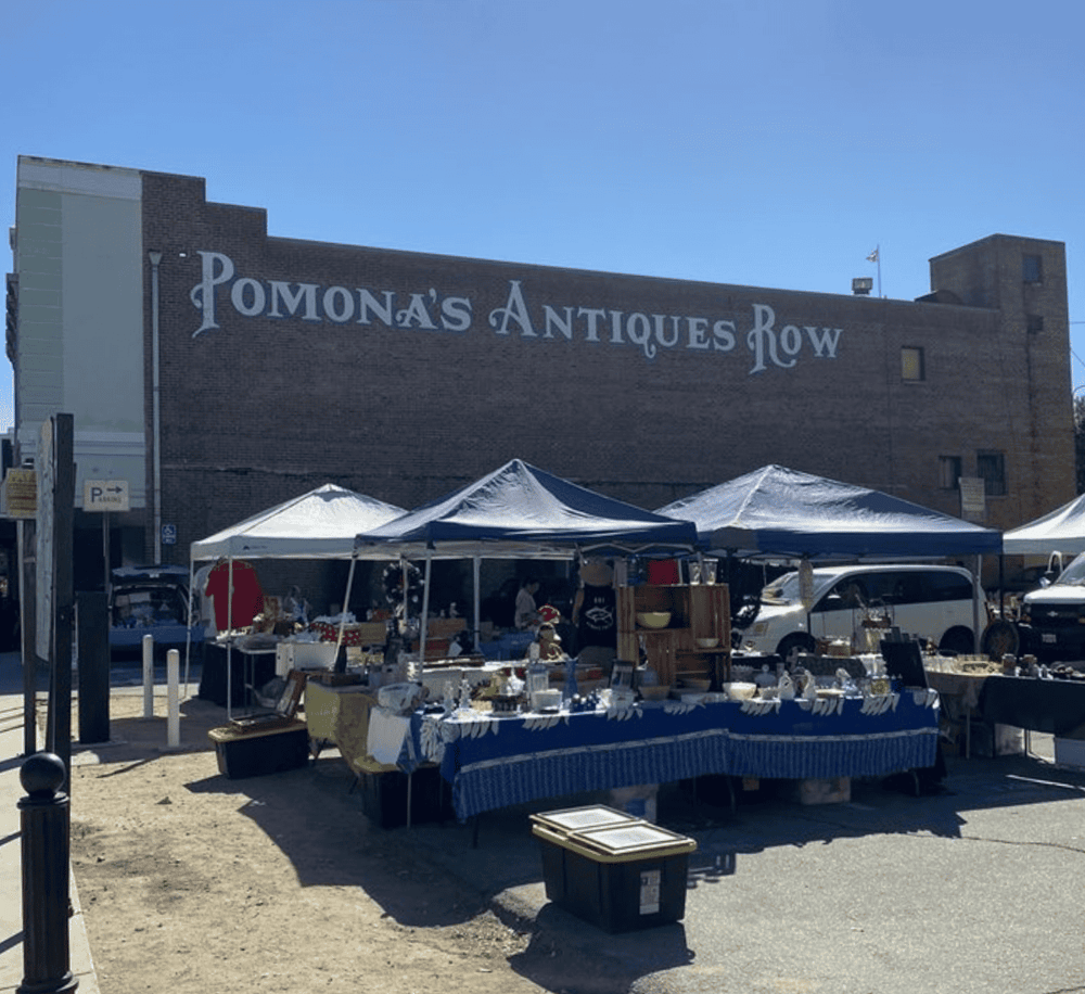Market vendor stalls at historic Pomona's Antiques Row flea market.