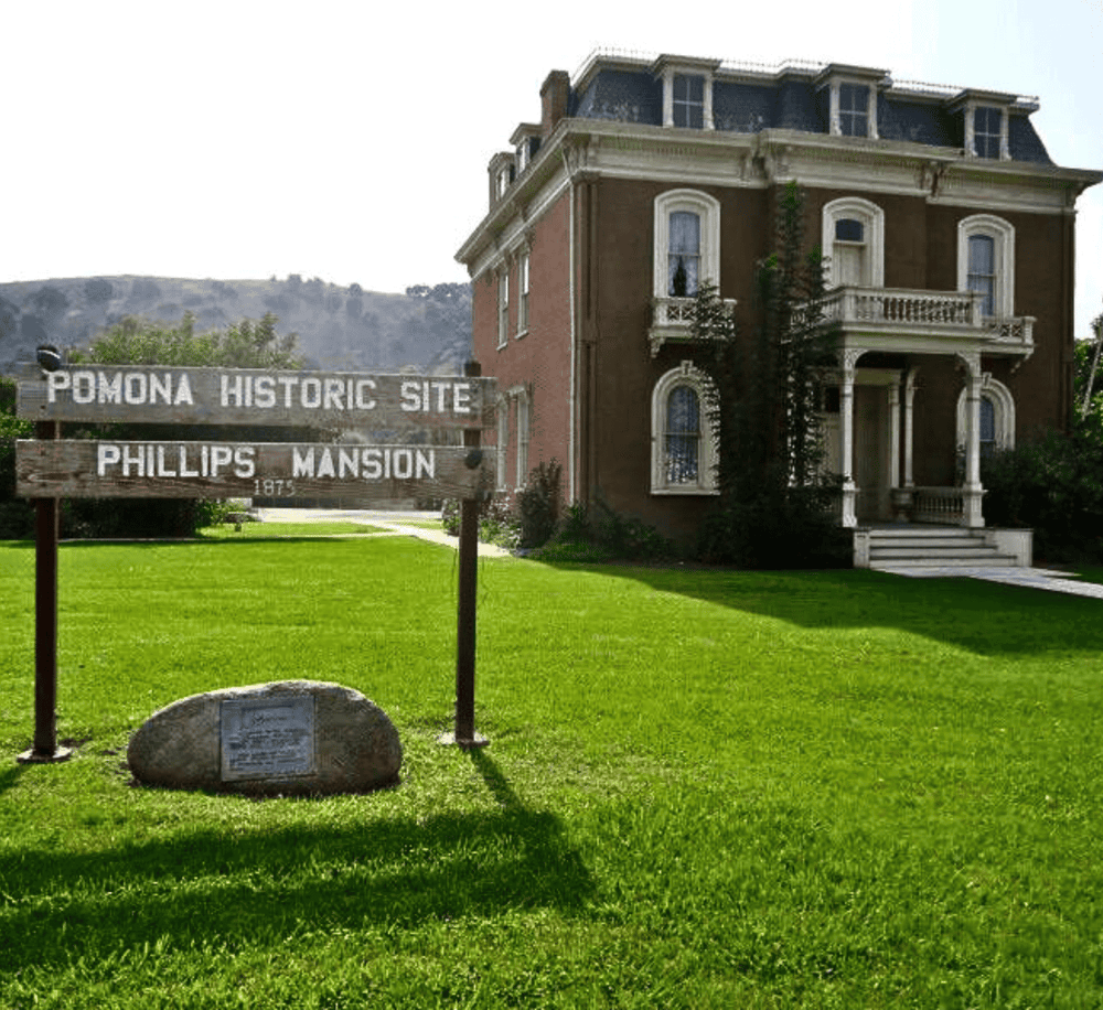 Historic Phillips Mansion at Pomona Historic Site, lush green lawns and vintage architecture.