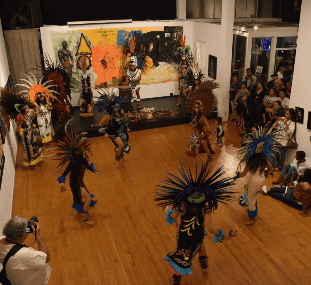 Colorful traditional dance performance at QuestForDirections art exhibit.