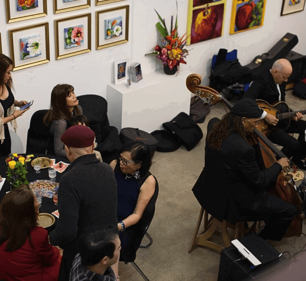 Soulful jazz music performance at an art gallery, vibrant artwork, and diverse audience enjoying live entertainment.