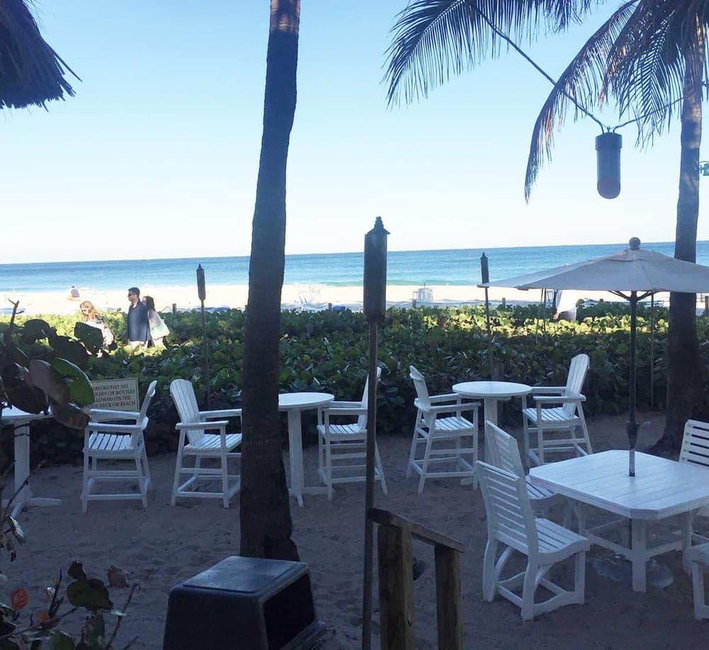 Relaxing beachside dining with ocean view and tropical setting at QuestForDirections.