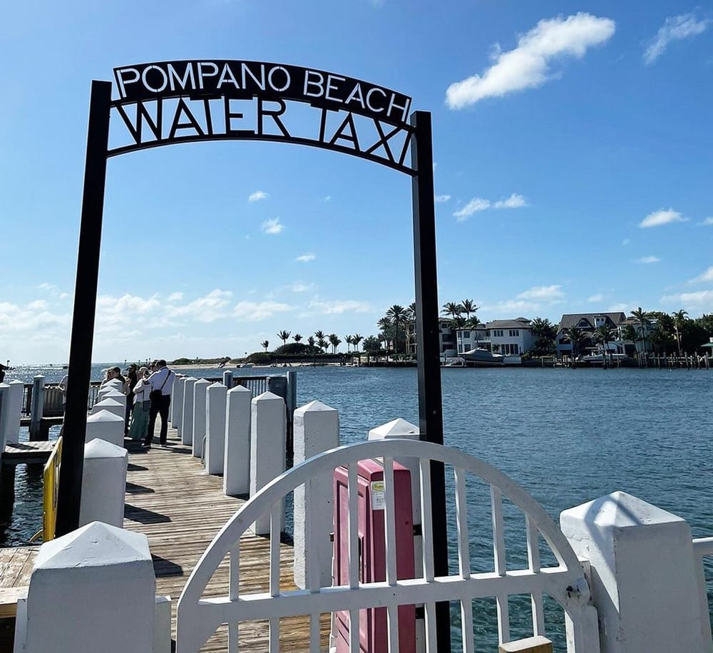 Water taxi at Pompano Beach waterfront dock in Florida, scenic coastal transportation.