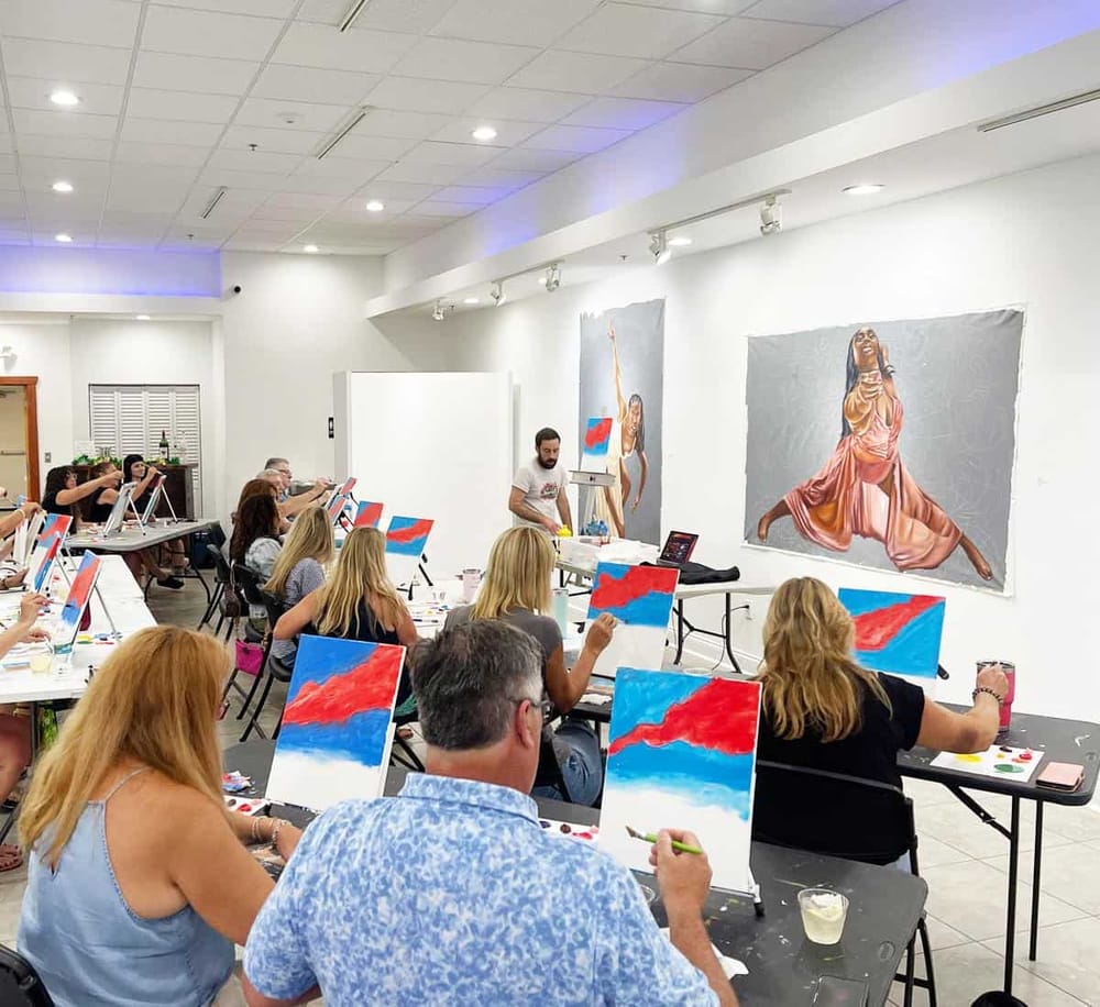 Vibrant acrylic painting class at QuestForDirections art studio with diverse participants.