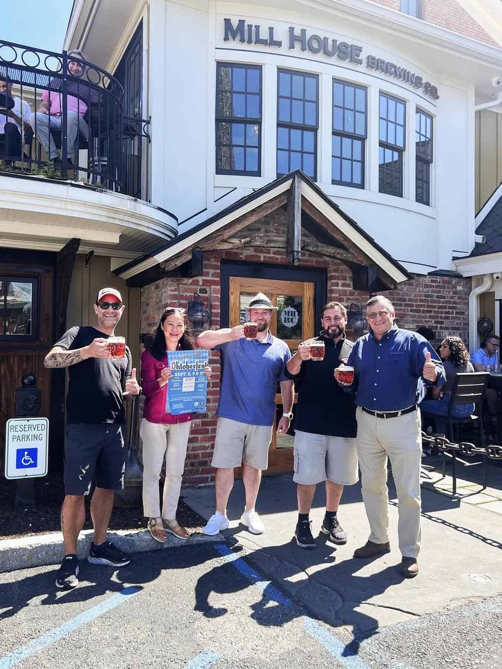 Outdoor group celebrating at Mill House Brewing Company.