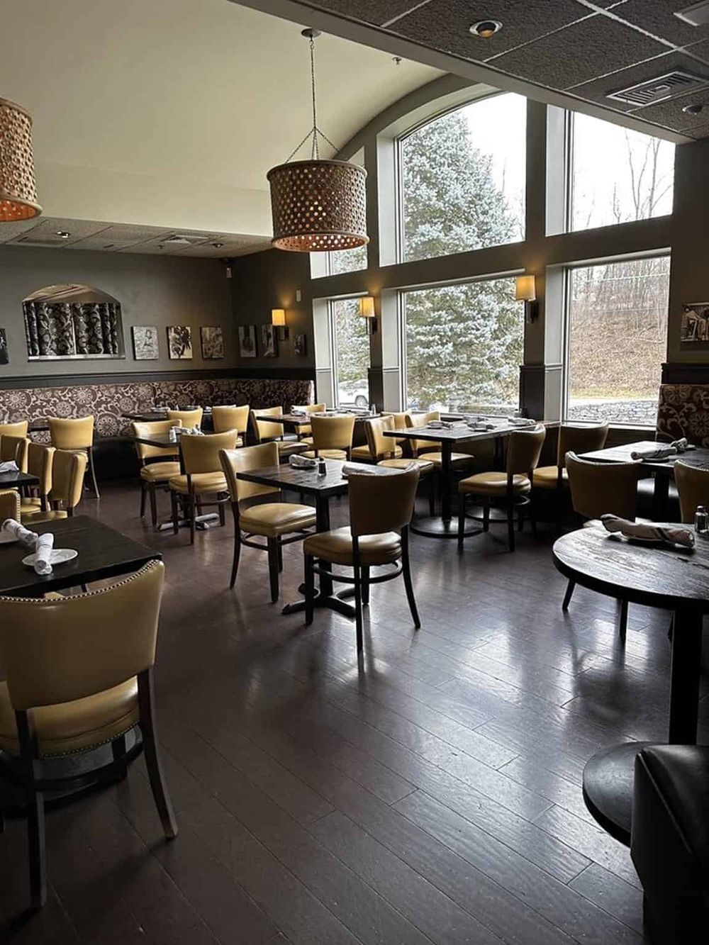 Cozy restaurant interior with large windows, stylish chairs, and warm lighting, perfect for relaxing dining at QuestForDirections.