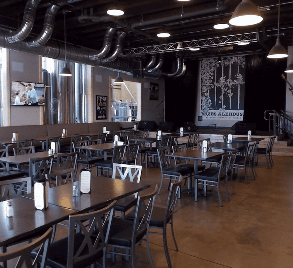 Bright brewery interior showcasing modern decor and spacious seating at Quest for Directions Brewery.