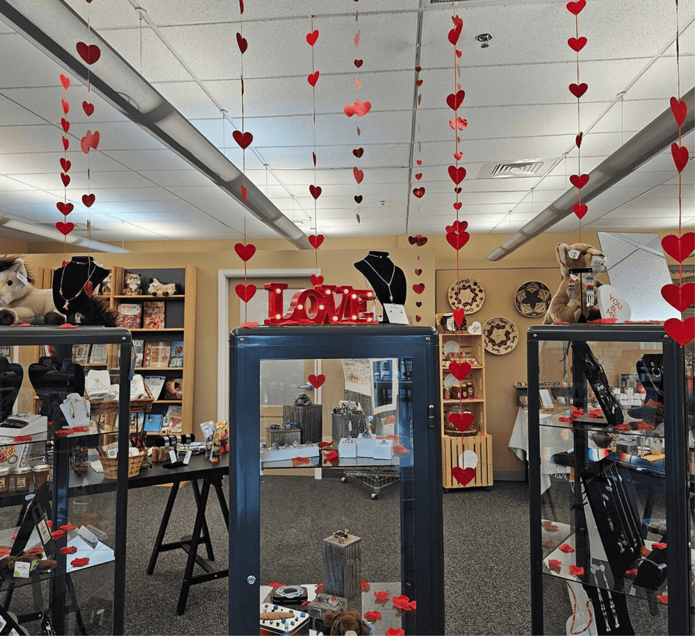 Heart-themed Valentine's Day decor and jewelry display at QuestForDirections. Perfect for romantic gift shopping.