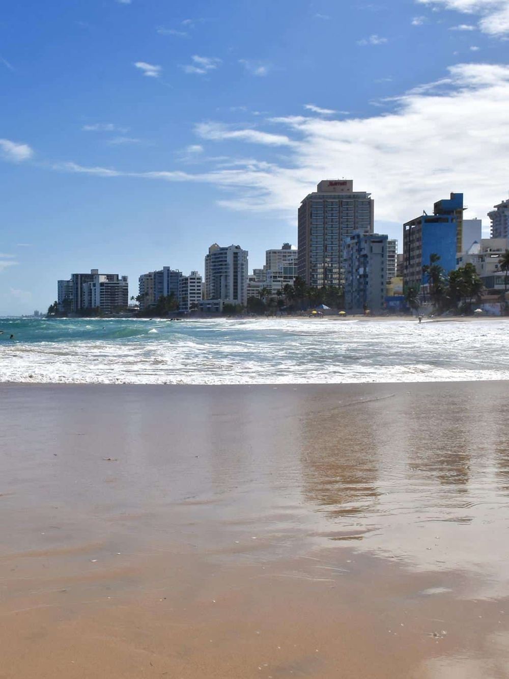 Vibrant Miami Beach skyline with sandy shore and blue ocean, perfect for travel and vacation photography.