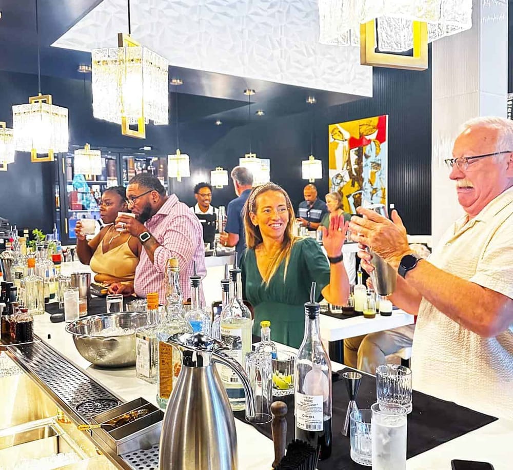 Stylish bar with diverse guests enjoying drinks at QuestForDirections, a top-rated nightlife and social venue.