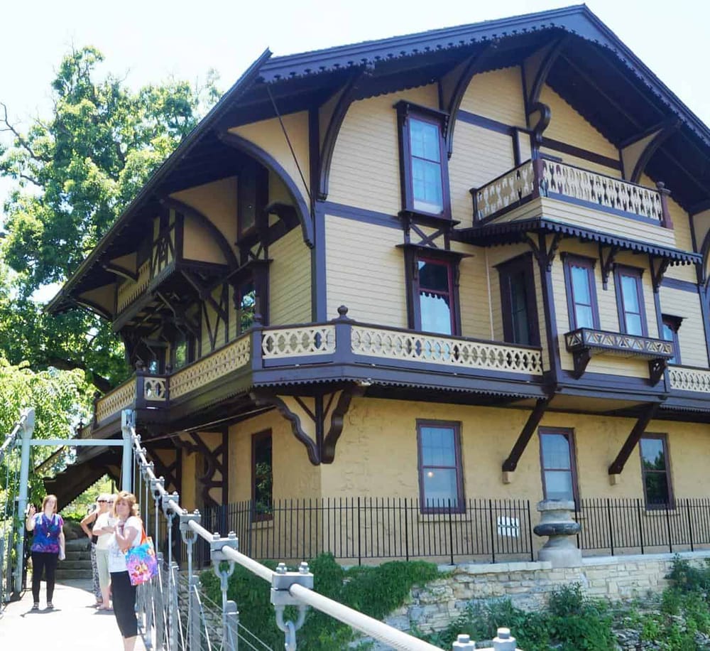 Victorian-style historic house with ornate woodwork and decorative balconies.