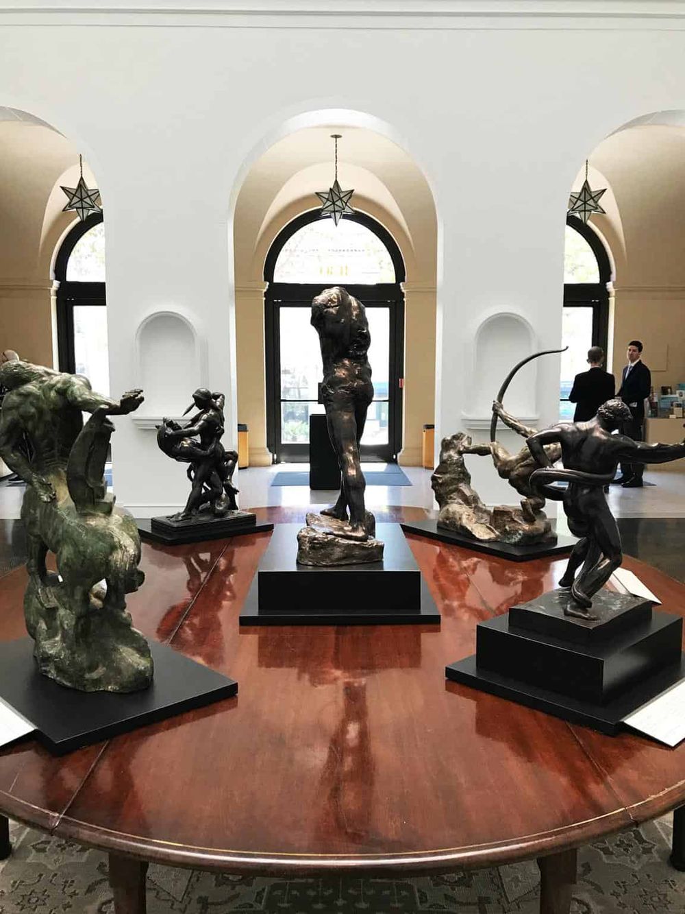 Bronze sculptures display inside museum, showcasing art and culture at QuestForDirections.