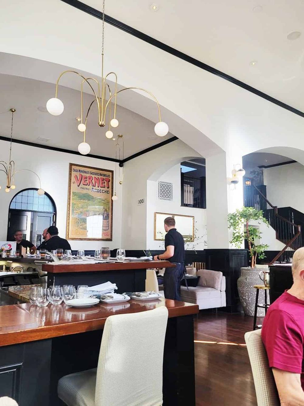 Elegant restaurant interior with modern lighting and stylish decor, ideal for dining and social gatherings.