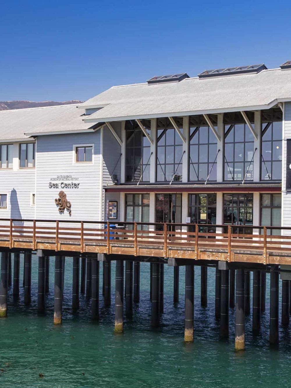 Overwater Sea Center building at Santa Barbara Island, Alaska, with ocean views and marine life exhibits.