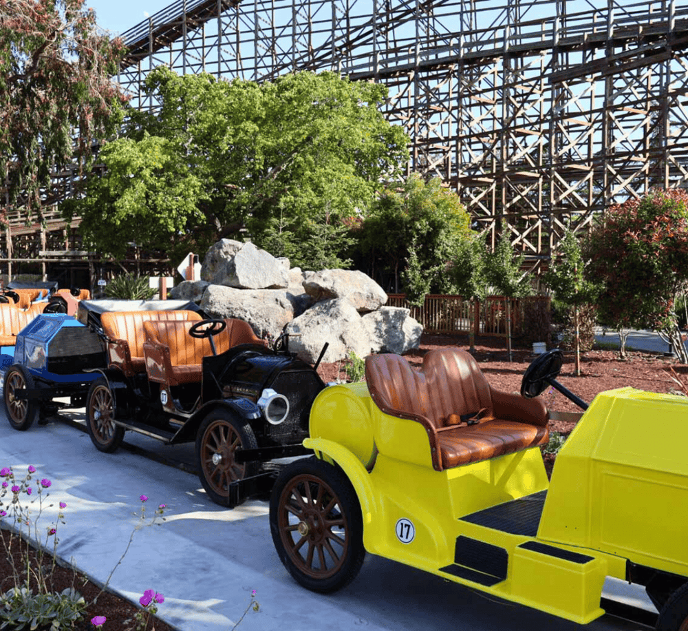 Vintage amusement park train rides at QuestForDirections theme park, offering family fun and scenic rides.