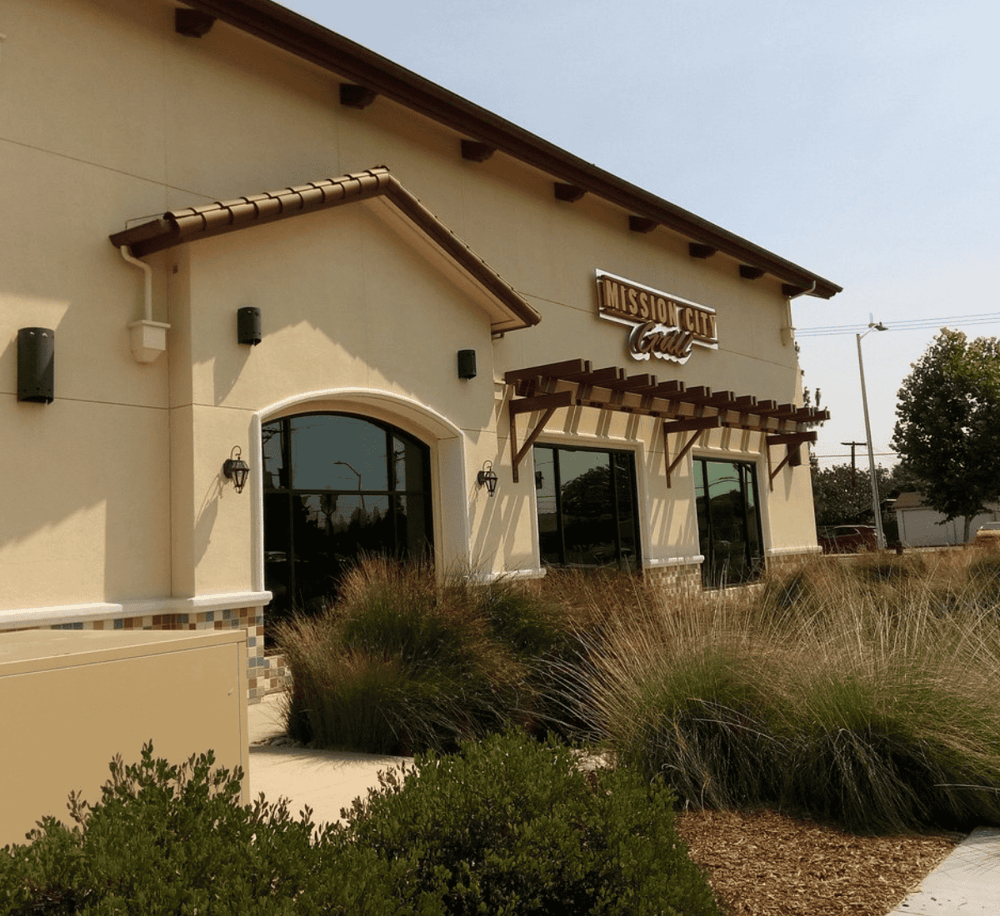 Modern Mission City Grill restaurant exterior with welcoming entrance and stylish design, ideal for dining and events.