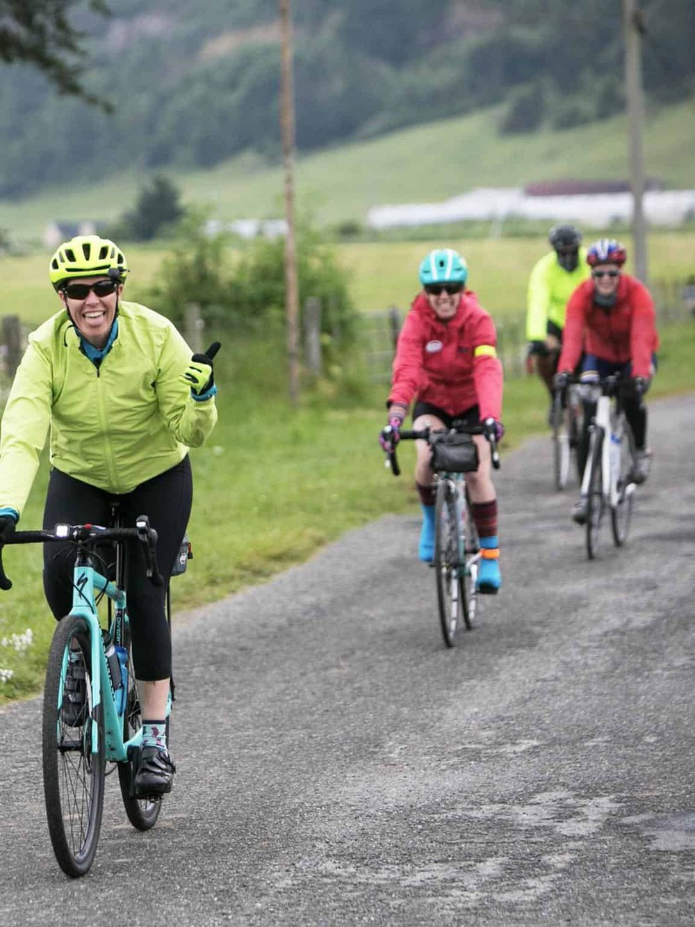 Vibrant cyclists enjoying outdoor adventure on scenic trail, promoting outdoor fun and fitness with QuestForDirections.