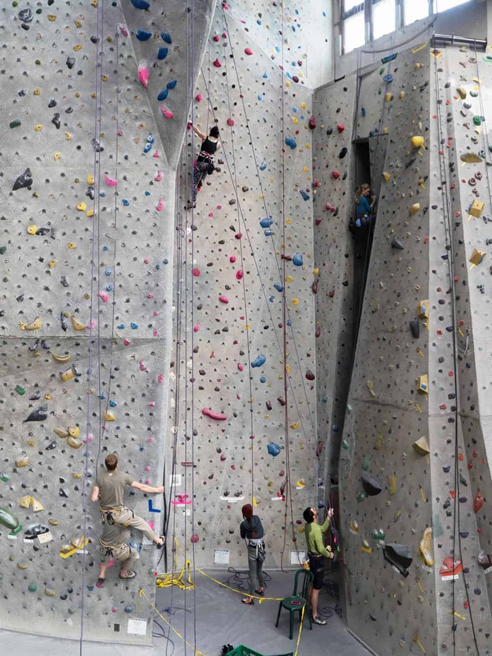 Colorful indoor rock climbing wall at QuestForDirections climbing gym.