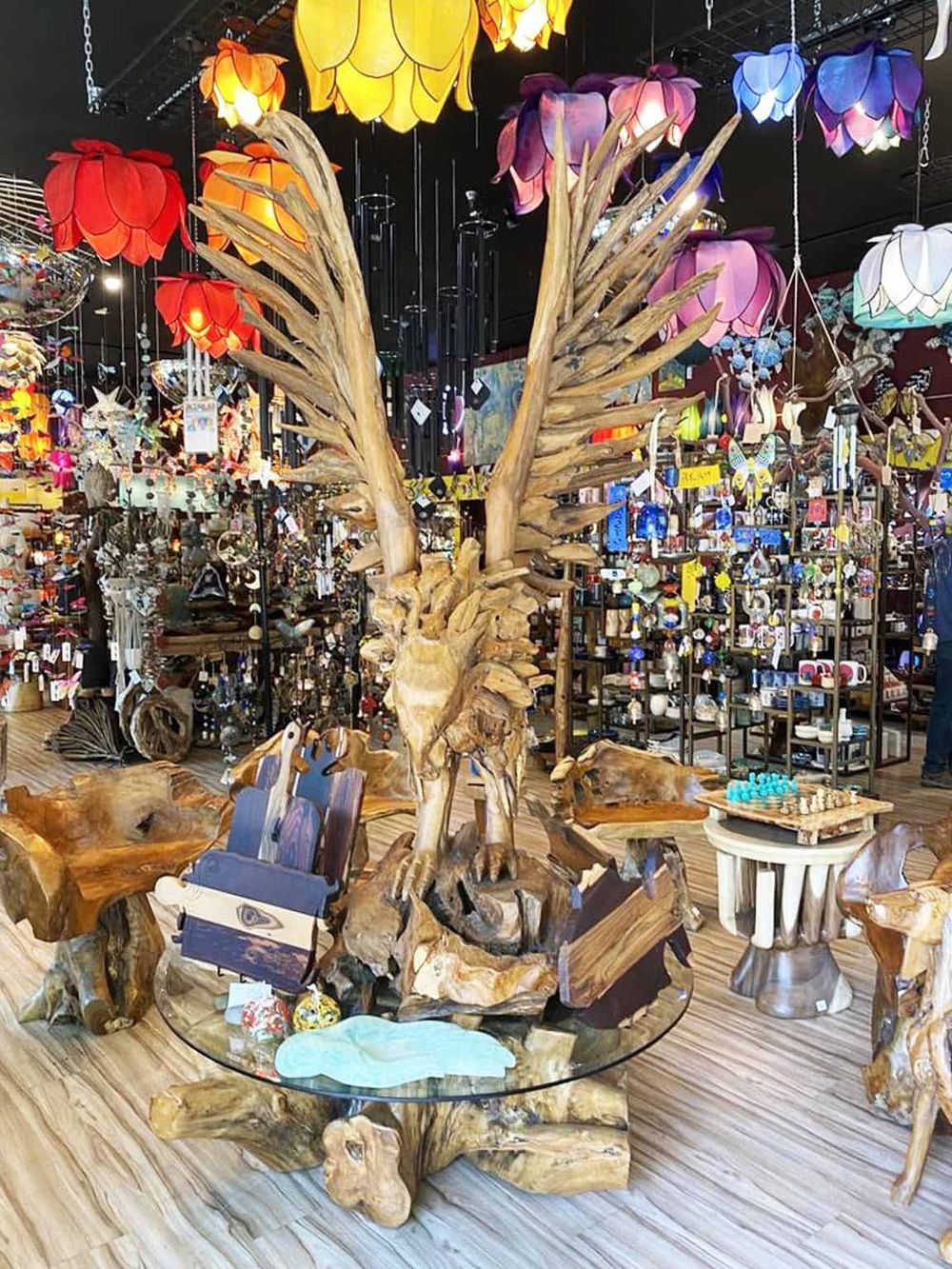 Colorful handcrafted lamp collection with unique wooden sculptures and décor pieces.