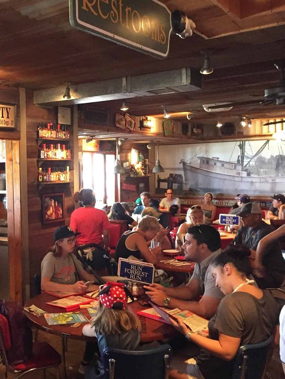 Unique restaurant interior with nautical decor and diverse group dining ambiance.