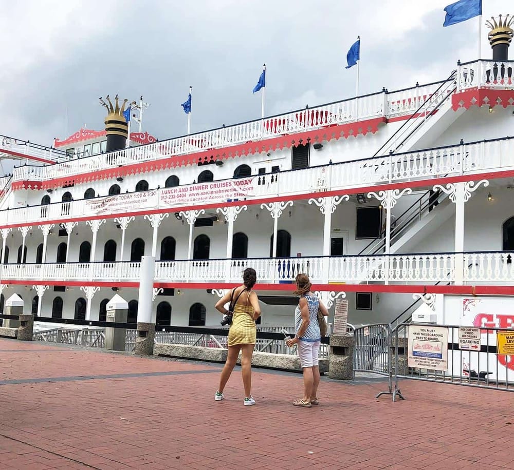 Historic riverboat cruise ship docked at the port for sightseeing tours.