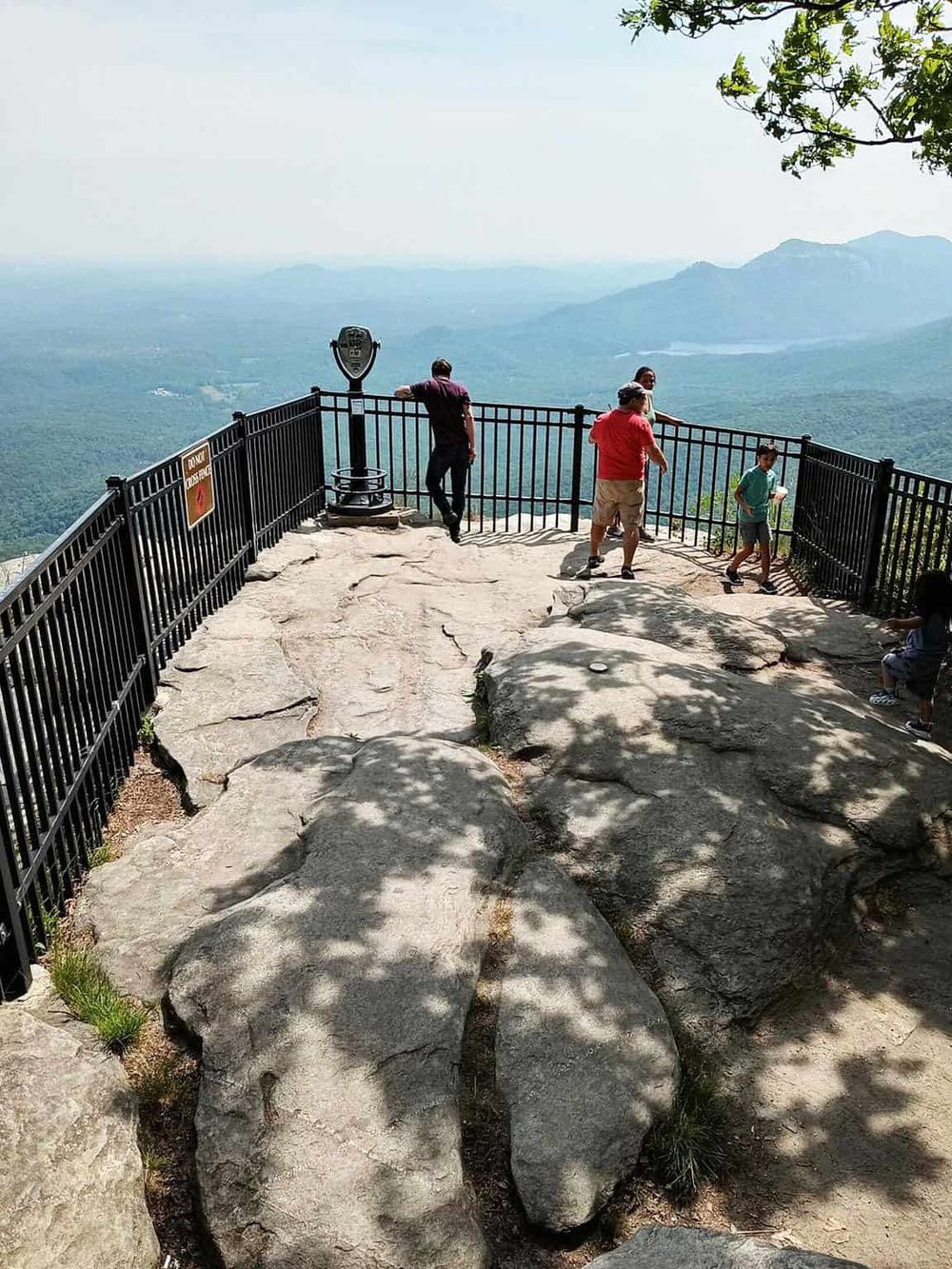 Breathtaking mountain view from observation deck with visitors enjoying scenic overlook.