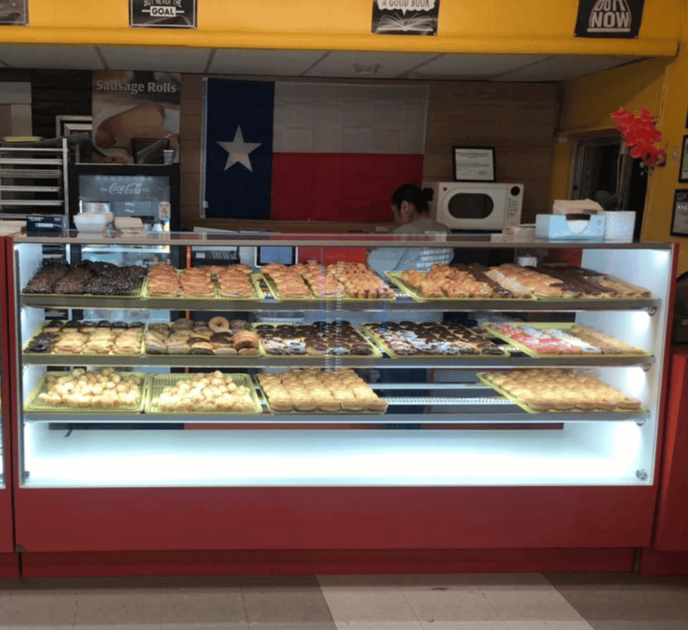 Delicious Texas-style baked goods and pastries in a cozy bakery with Texas flag decor.
