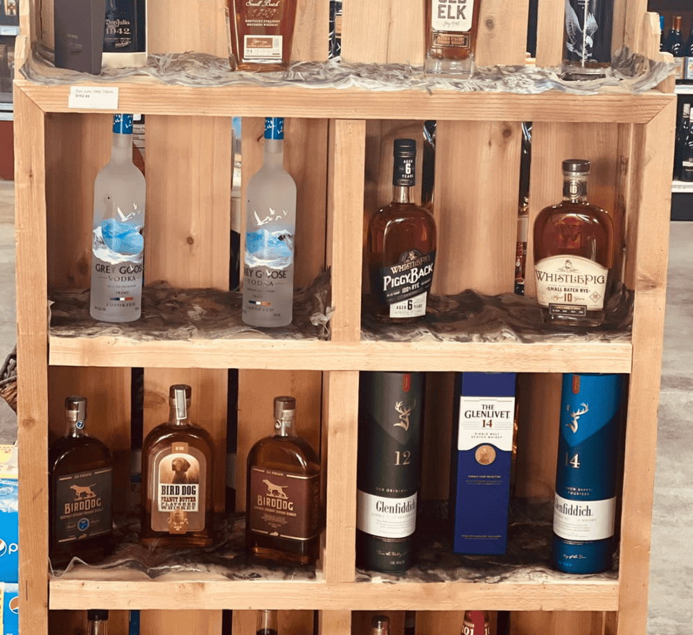 Aromatherapy and whiskey display in a retail store for buying premium spirits and scented products.