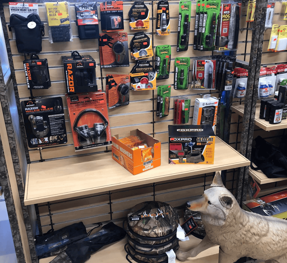 Radio controlled hunting dog toy and outdoor gear display at QuestForDirections, specializing in hunting and outdoor accessories.