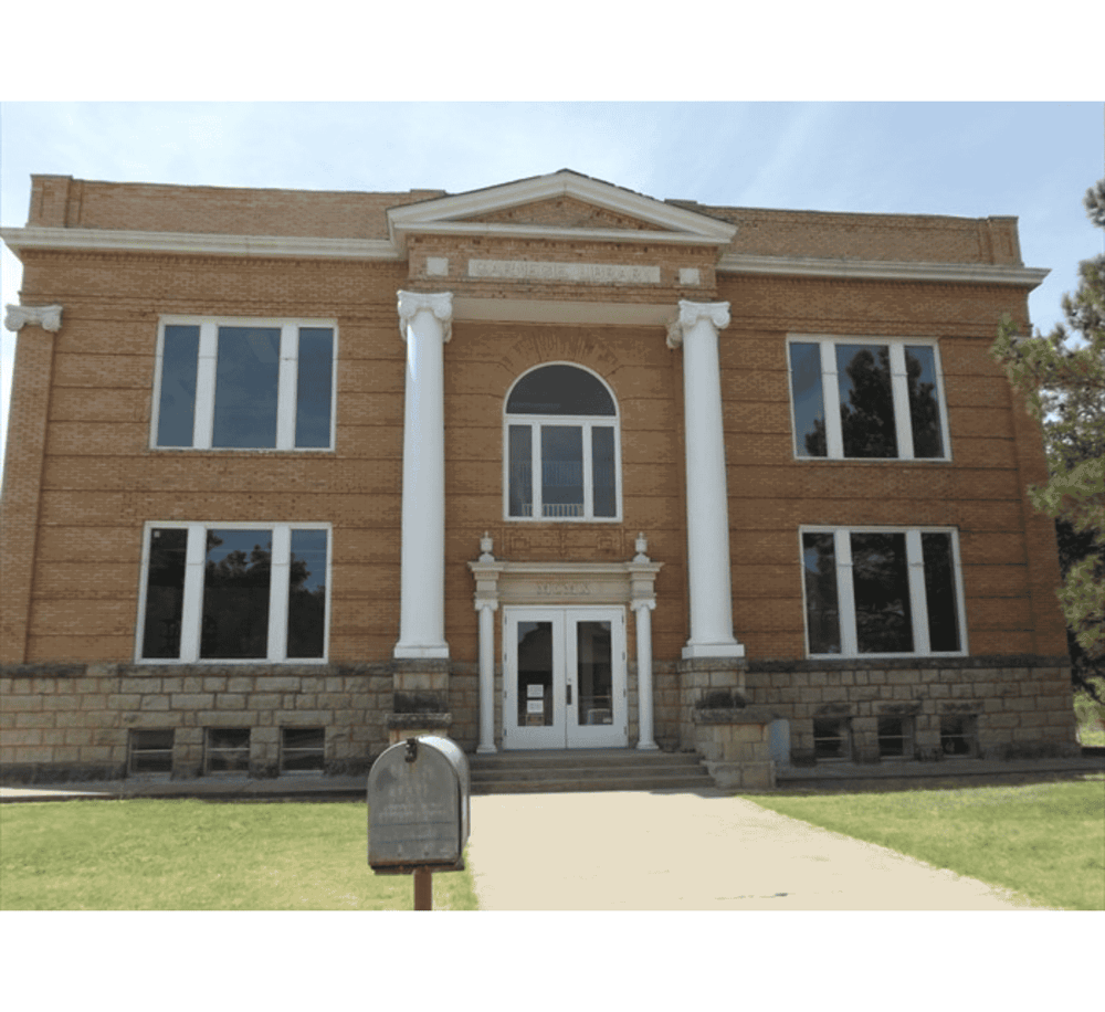 Historic courthouse building with columns and brick facade, located in QuestForDirections area.