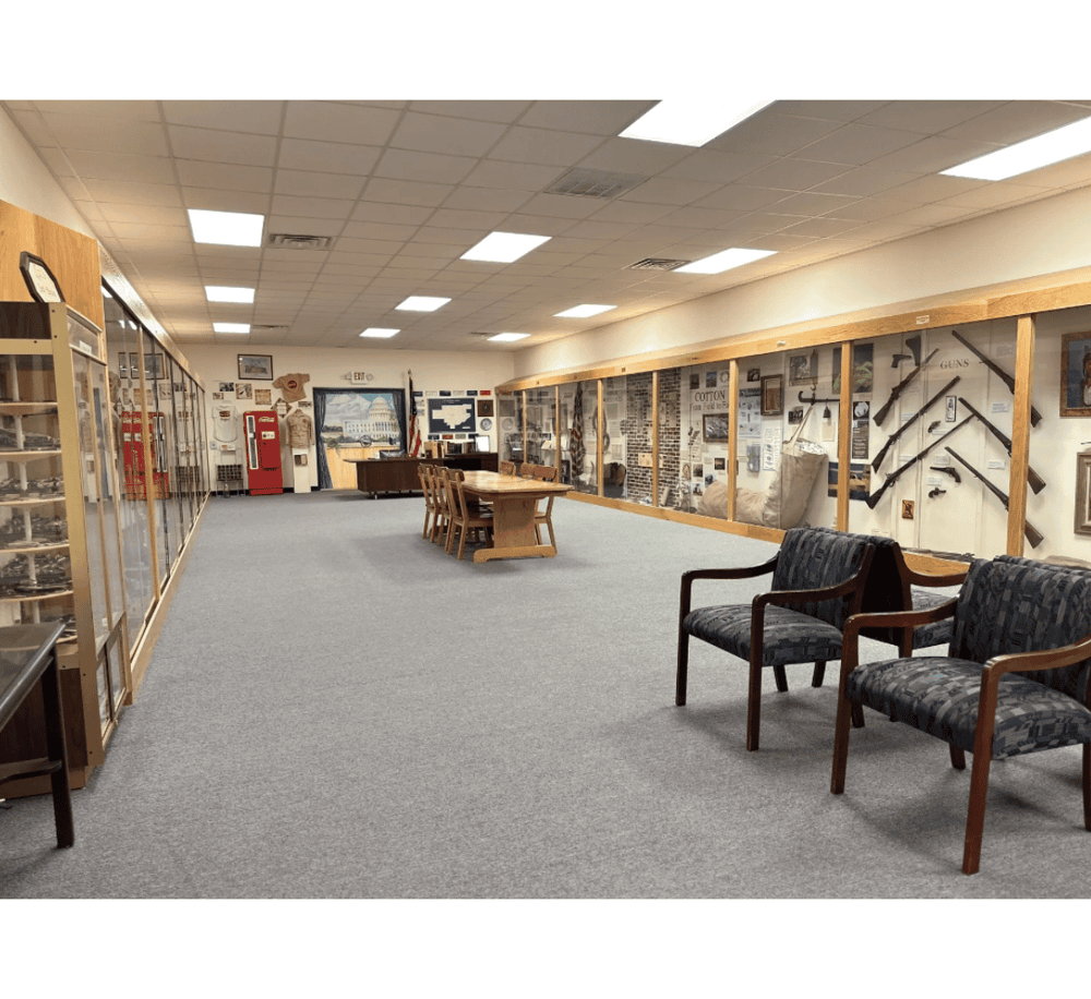 Historical museum interior with military displays and memorabilia for historical education.