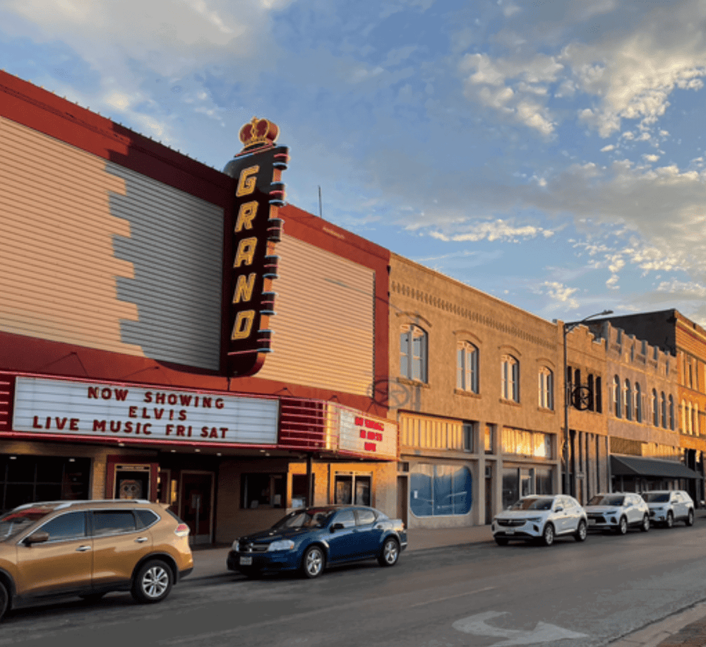 Vintage theater marquee showcasing Elvis Presley live music event in downtown.