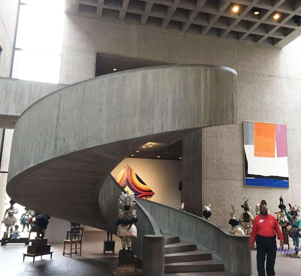 Contemporary indoor staircase with modern art and sculptures at QuestForDirections.