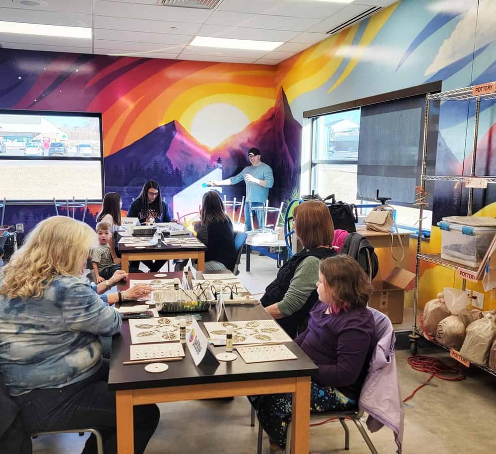 Colorful mountain mural art workshop for adults and kids at QuestForDirections creative space.
