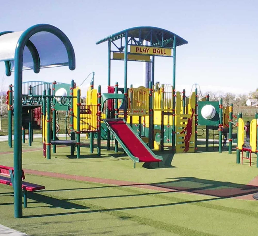 Colorful playground with slides and play structures at QuestForDirections park.