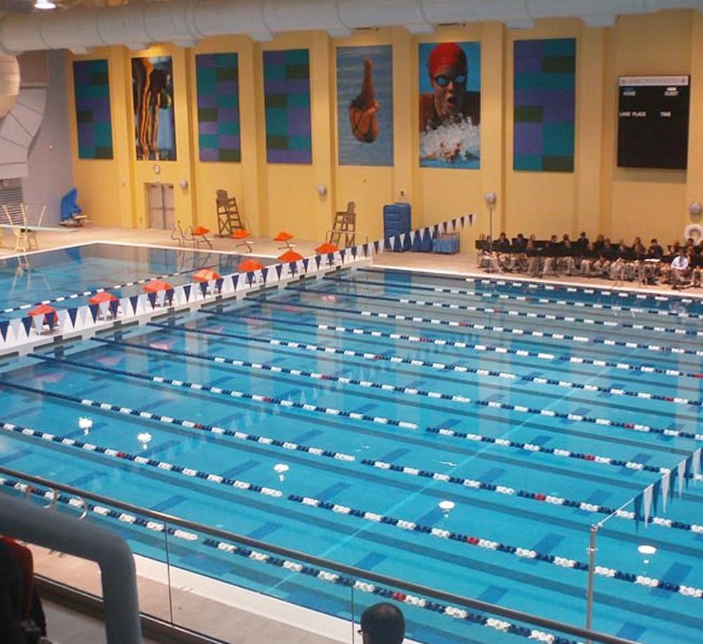 Smooth indoor swimming pool with multiple lanes for competitive swimming and training.