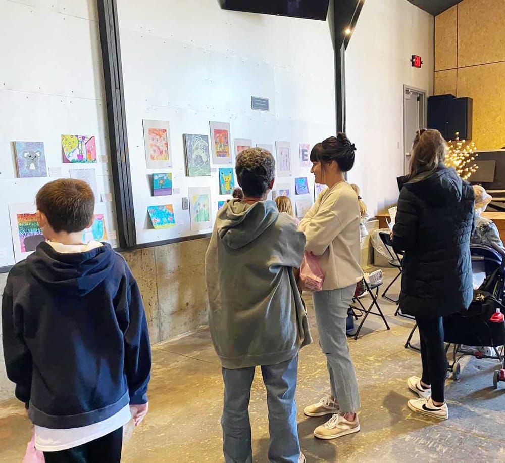 Colorful artwork displayed at QuestForDirections community event, engaging visitors in creative activities.