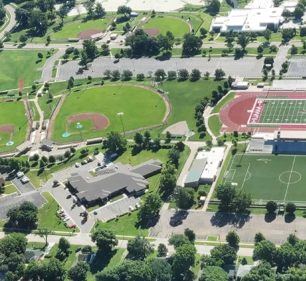 Field sports complex and athletic facilities at QuestForDirections educational campus.