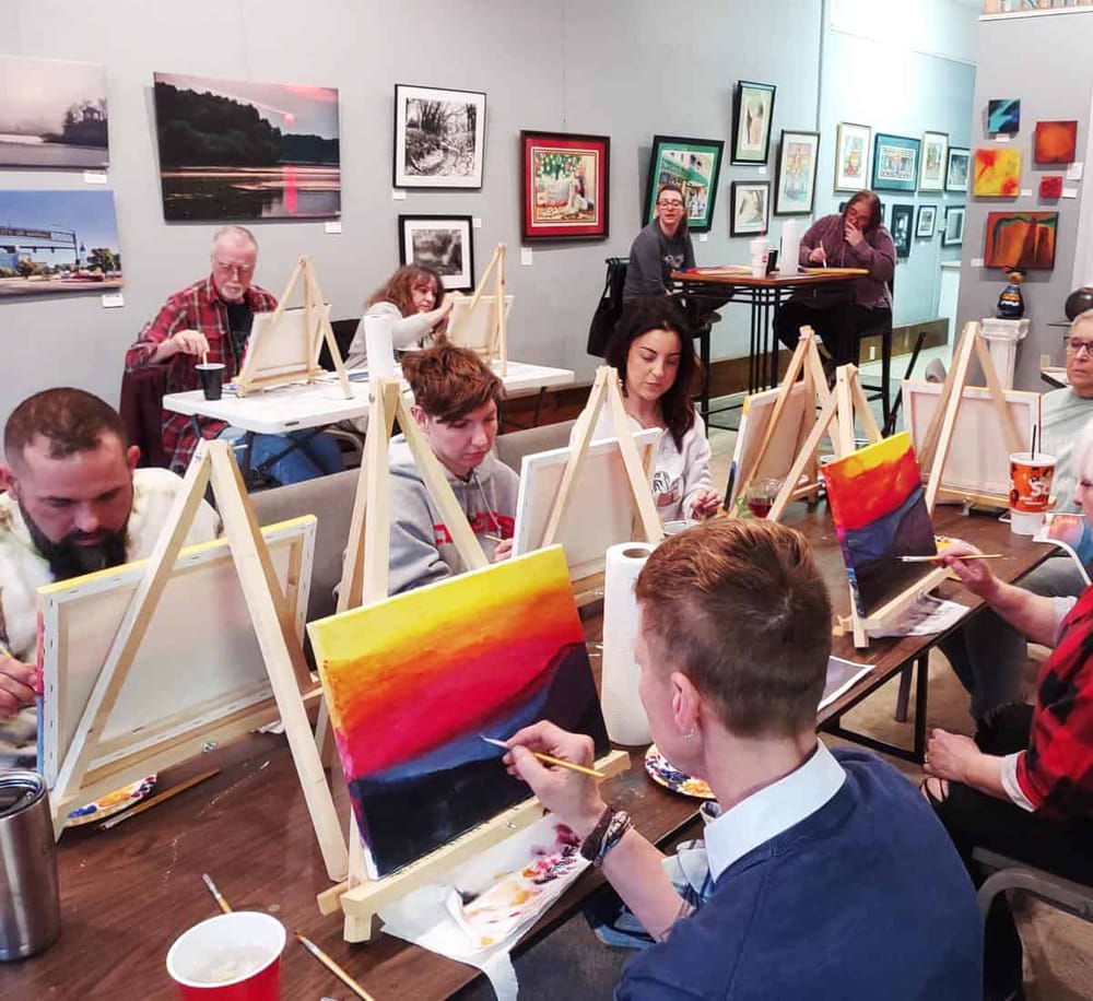 Create your own artwork at QuestForDirections art class in a vibrant gallery setting.
