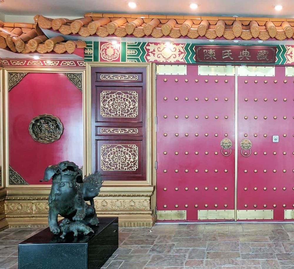 1. Ornate Chinese-style entrance with red doors, gold accents, and traditional decor.
