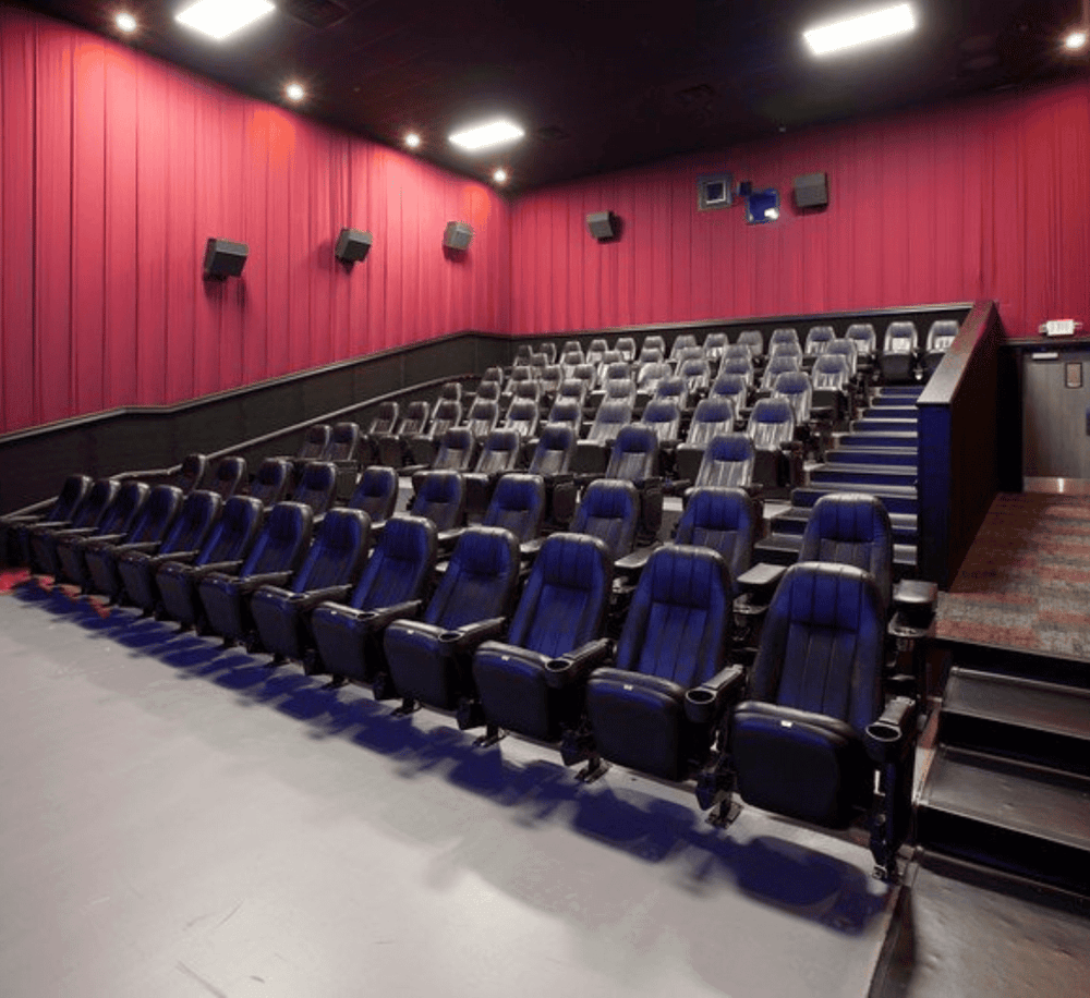 Auditorium with comfortable leather seats for movie screenings and events. Perfect venue for entertainment and gatherings.