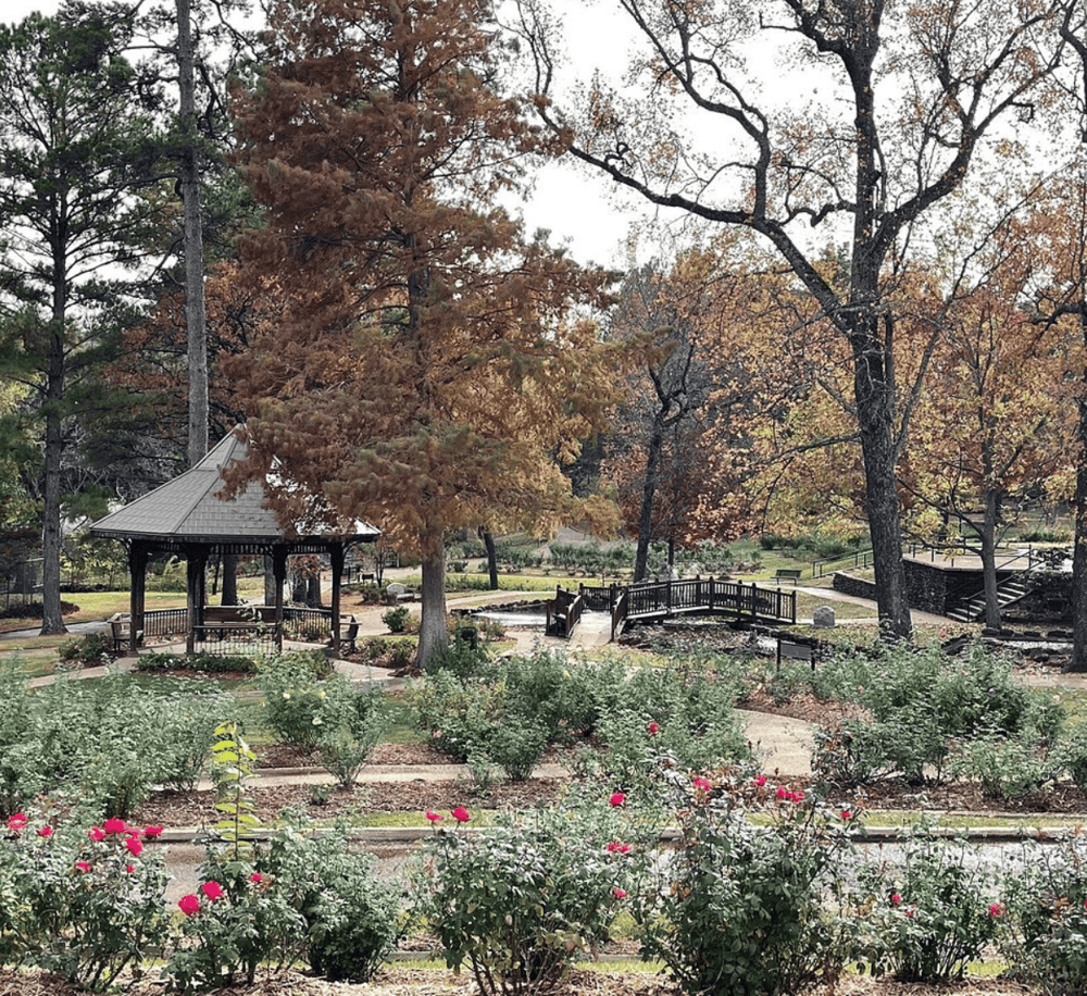 Serene park with gazebo, walking paths, and colorful fall foliage, perfect for outdoor leisure and relaxation.