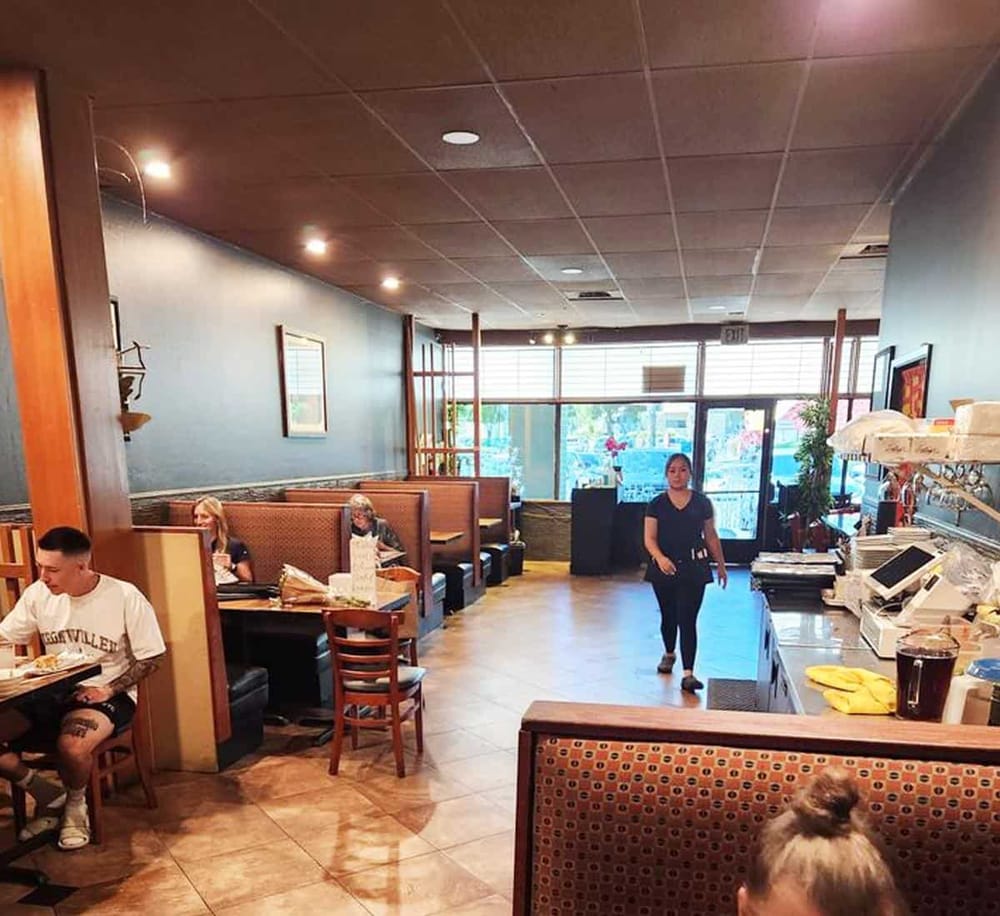 Comfortable American restaurant interior with booth seating and casual dining atmosphere.