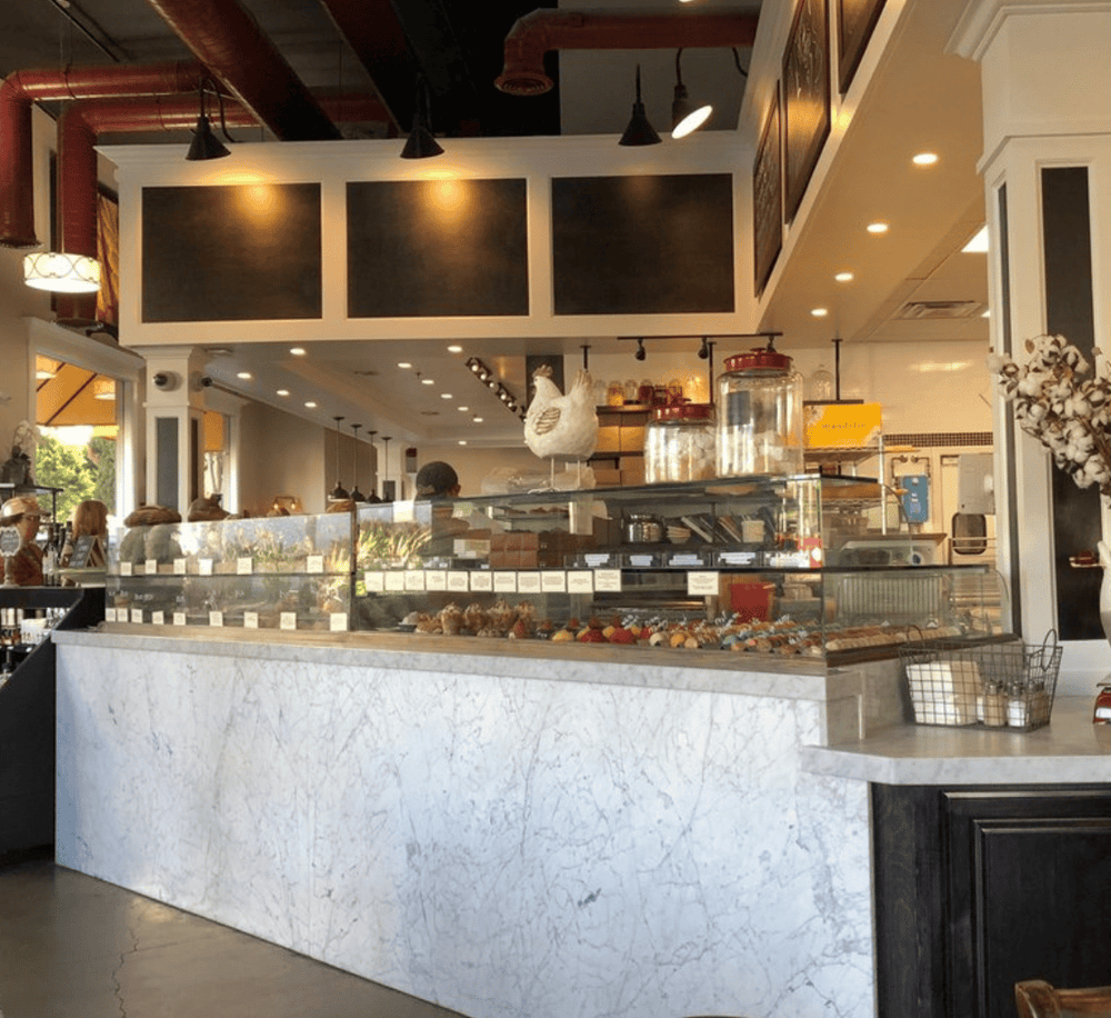 Delicious bakery display with assorted pastries inside QuestForDirections cafe.