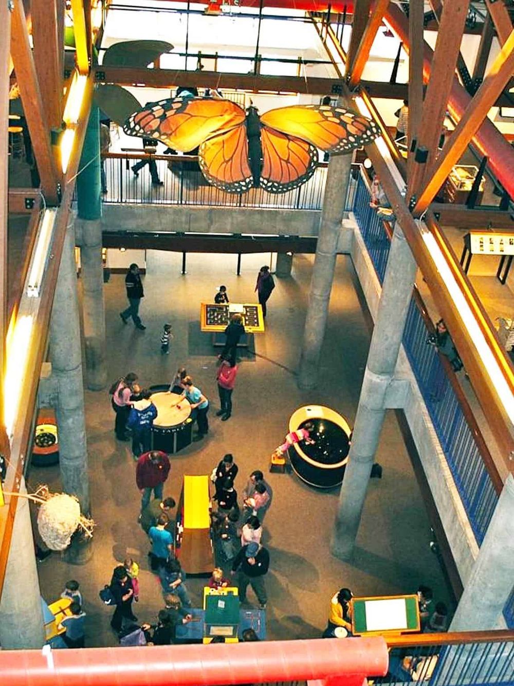 Colorful butterfly-shaped sculpture in an interactive science museum or educational center.