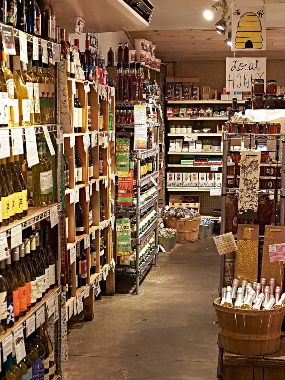 Organic wine and honey shop with local products in a cozy grocery store atmosphere.