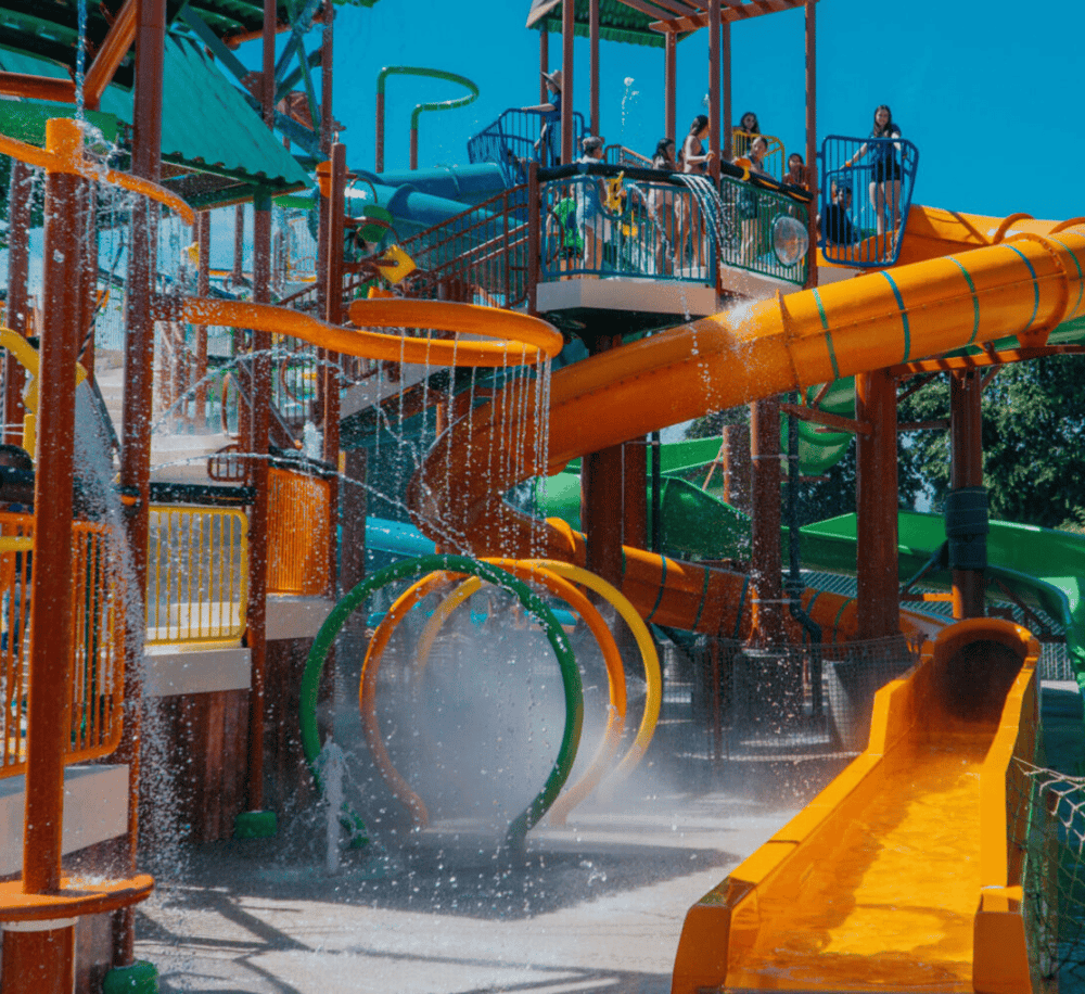 Colorful water park playground with slides and water features for family fun and children's entertainment.