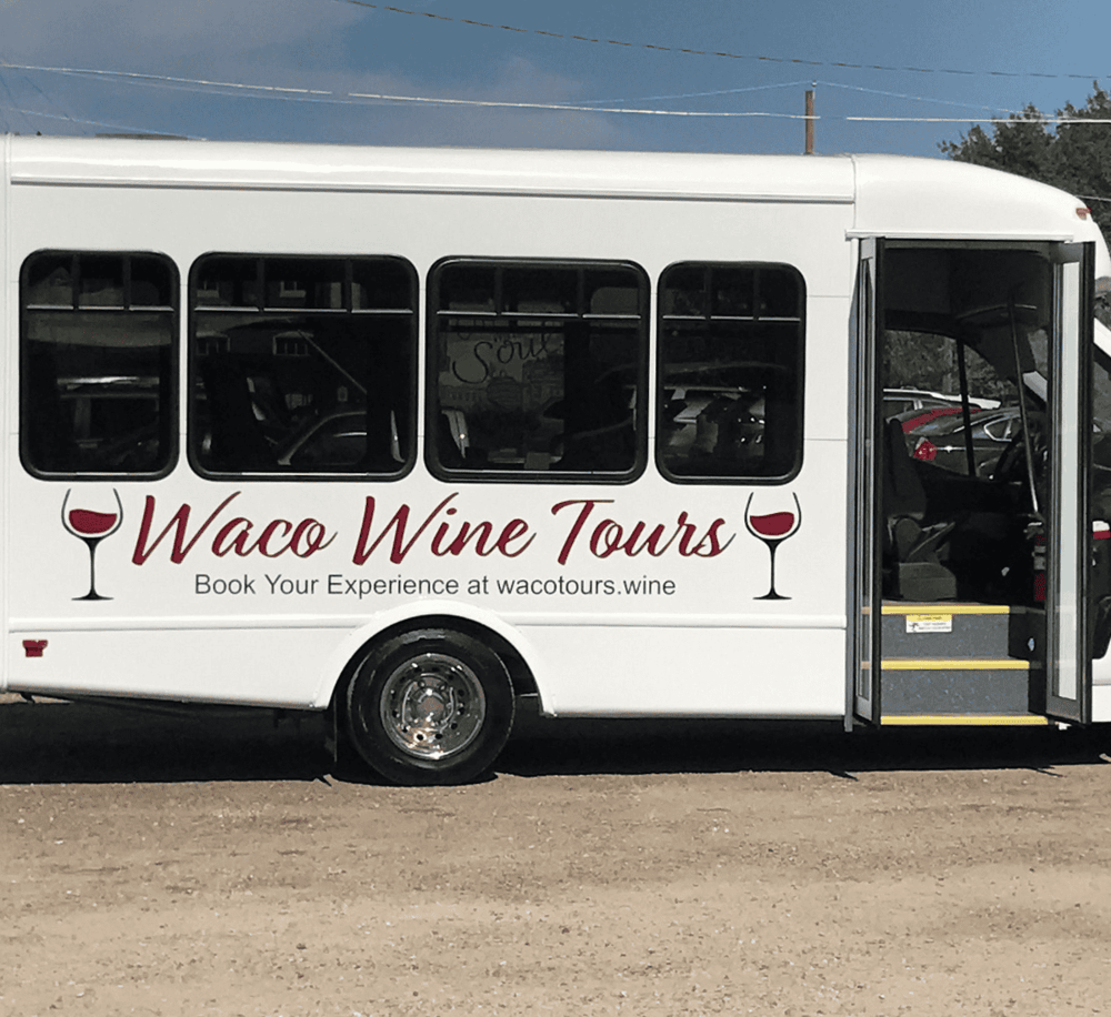 Wine tour bus promoting Waco wine tours for memorable wine tasting experiences.