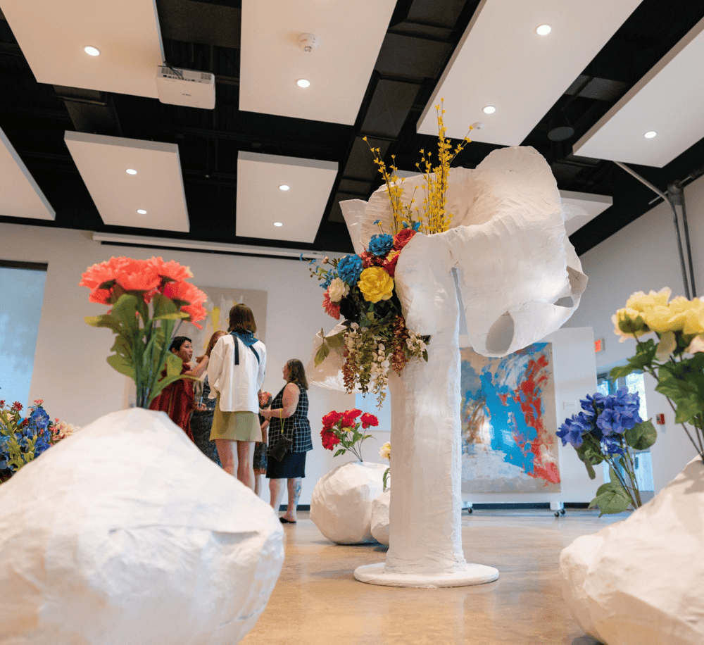 Vibrant floral art installation at QuestForDirections art gallery, showcasing contemporary sculptures and creative design.