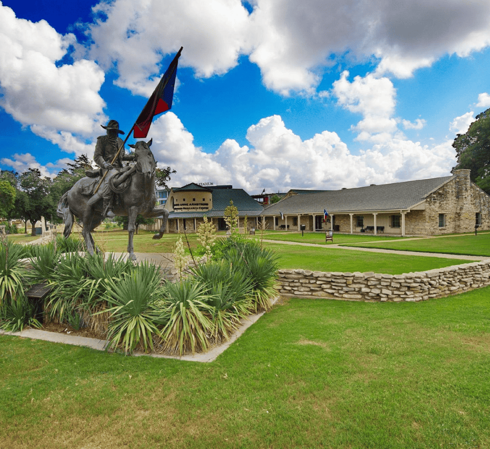 Statue of a mounted soldier holding a flag at Texas State Historic Site in Austin, Texas.